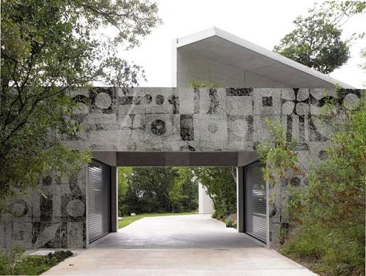Casa Monterrey, Monterrey, Mexico. Architect: Tadao Ando, 2013. View towards 'private' entrance with garages.